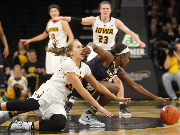 Iowa's Kathleen Doyle gets hit in the face as she fights