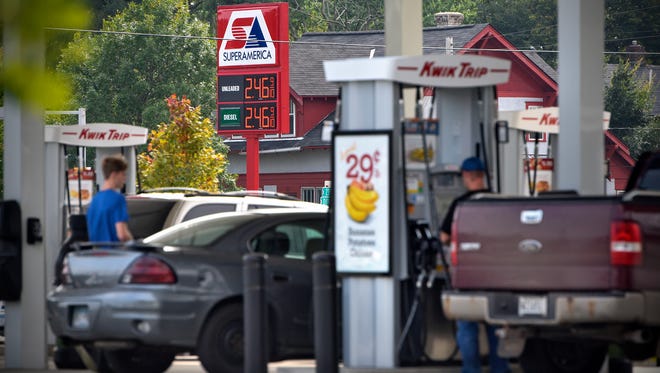 People fill their tanks along Minnesota Highway 23 Friday, Sept. 1, in St. Cloud.
