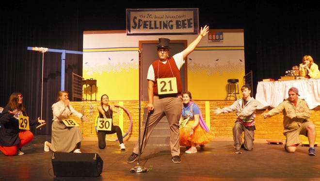 Fond du Lac Community Theater member Noah Goebel, playing William Barfee, poses with the rest of the cast at the end of a musical number during rehearsals for "The 25th Annual Putnam County Spelling Bee."