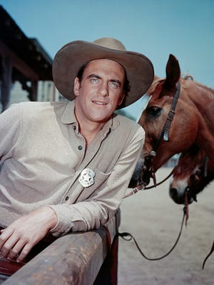 Actor James Arness is shown portraying Marshal Matt Dillon in "Gunsmoke" in this undated photo.
