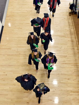 Graduates line up for York College of Pennsylvania's 2016 winter commencement ceremony.