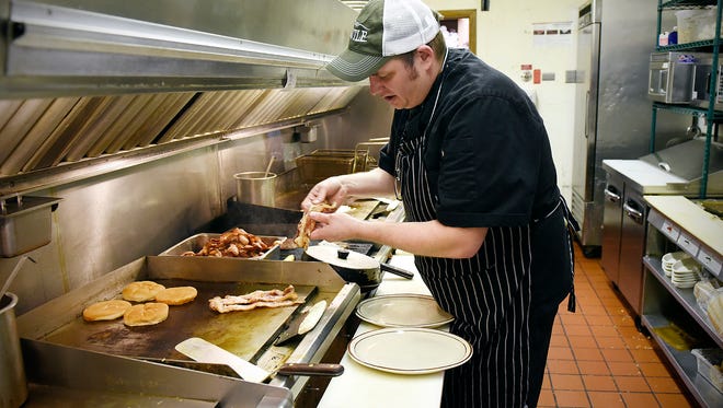 Rory Amundson, the new owner of the The Kettle restaurant, works the grill Tuesday, Jan. 5 in Clearwater.