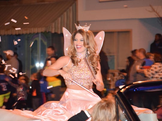 Miss New Jersey Lindsey Giannini of Hammonton sprinkles “fairy dust” while riding in the 40th annual Hammonton Halloween Parade.