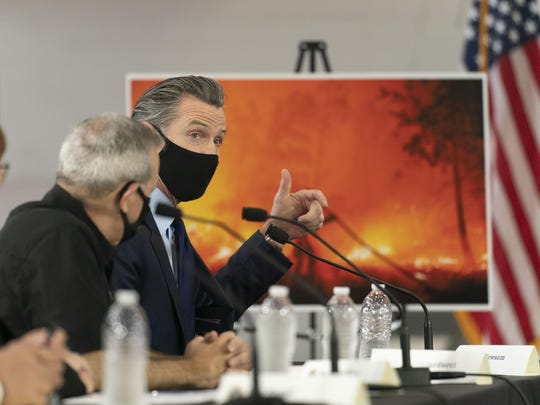 California Gov. Gavin Newsom speaks during a briefing with President Donald Trump at Sacramento McClellan Airport, in McClellan Park, Calif., Monday, Sept. 14, 2020, on the wildfires.