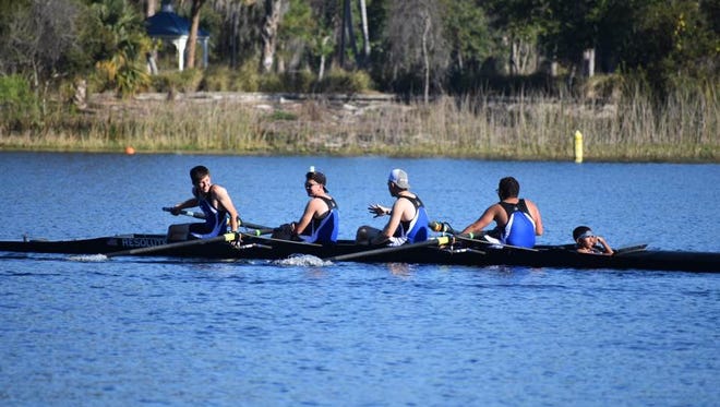 Gold medal winners at last weekend's Novice Regatta on Turkey Lake in Orlando, the Sebastian River High School Sharks crew men's novice four celebrates after crossing the finish line.