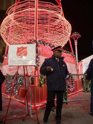 Envoy Ralph Mason of Acres of Hope Harbor Light rings a bell after the lighting of The Salvation Army World's Tallest Kettle during the 2015 Detroit Tree Lighting Ceremony on Friday November 20, 2015 at Campus Martius Park in downtown Detroit.