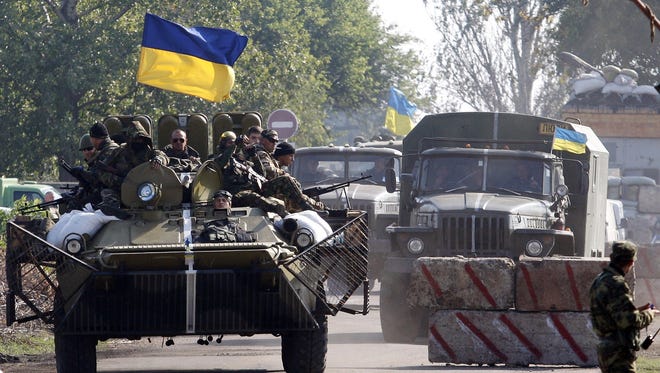 Ukrainian servicemen patrol in the Donetsk region on Monday.