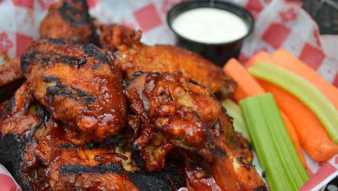 These "Stache Wings" are made with big sexy sauce and done Ralph's way, which means they are flame kissed after being deep fried and sauteed.