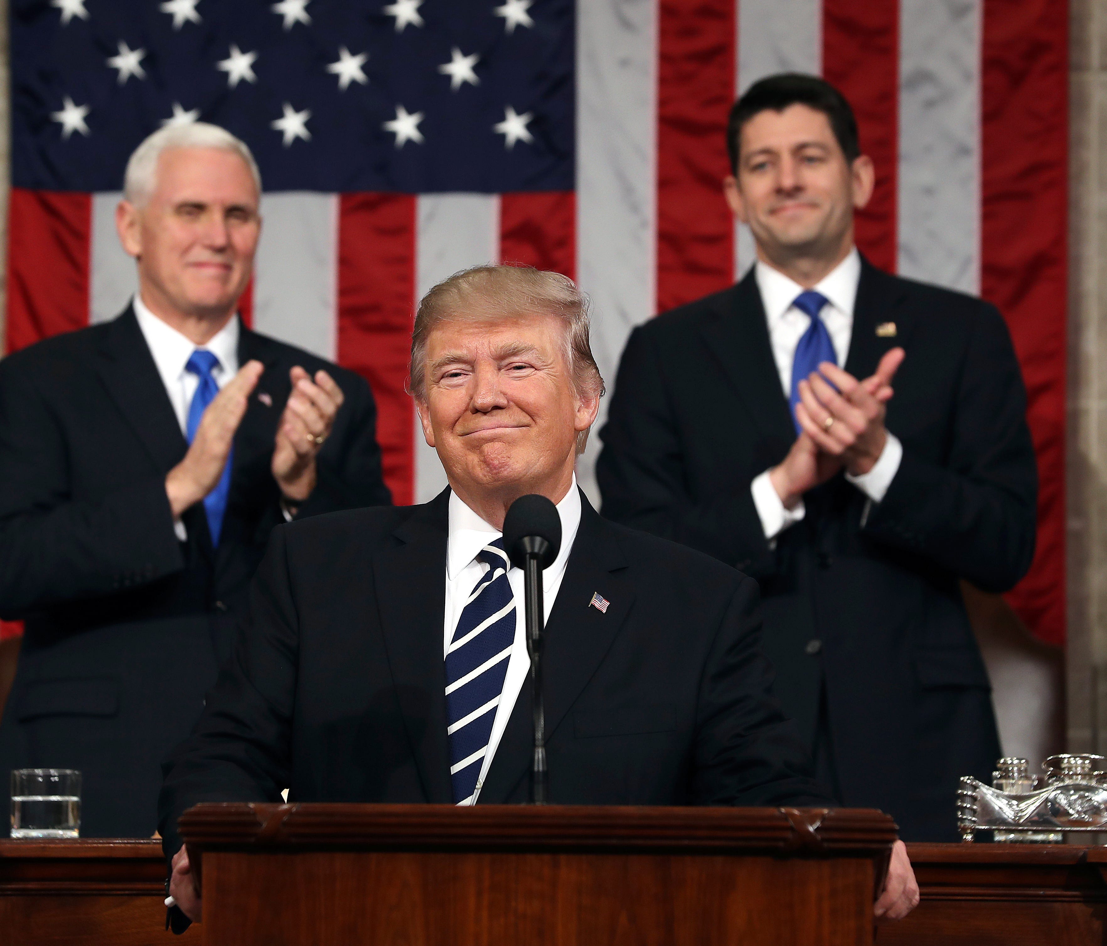 President Trump, flanked by Vice President Mike Pence and House Speaker Paul Ryan, delivered an address to a joint session of Congress on Feb. 28, 2017.