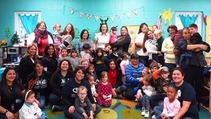 American Bank Center staff with the children of the Rise School of Corpus Christi, Dec. 9, 2016.