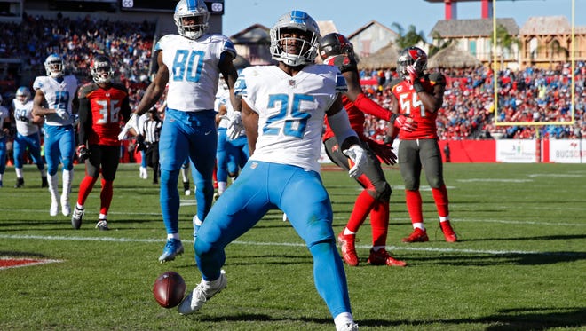 Theo Riddick (25) of the Detroit Lions runs into the end zone for an 18-yard touchdown in the third quarter of a game against the Tampa Bay Buccaneers at Raymond James Stadium on December 10, 2017 in Tampa, Florida. The Lions won 24-21.