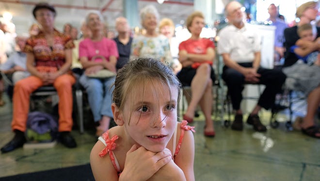 A young girl enjoys listening to a Heifetz concert last year at Sunspots Studios in Staunton.