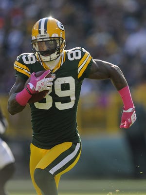 Green Bay Packers receiver James Jones (89) runs downfield after making a catch against the Jacksonville Jaguars at Lambeau Field.