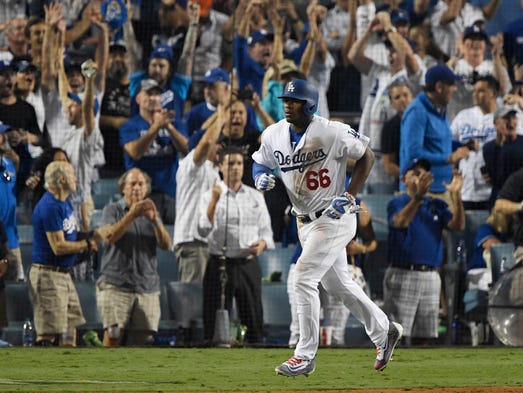 Game 2 at Dodger Stadium: Yasiel Puig rounds the bases