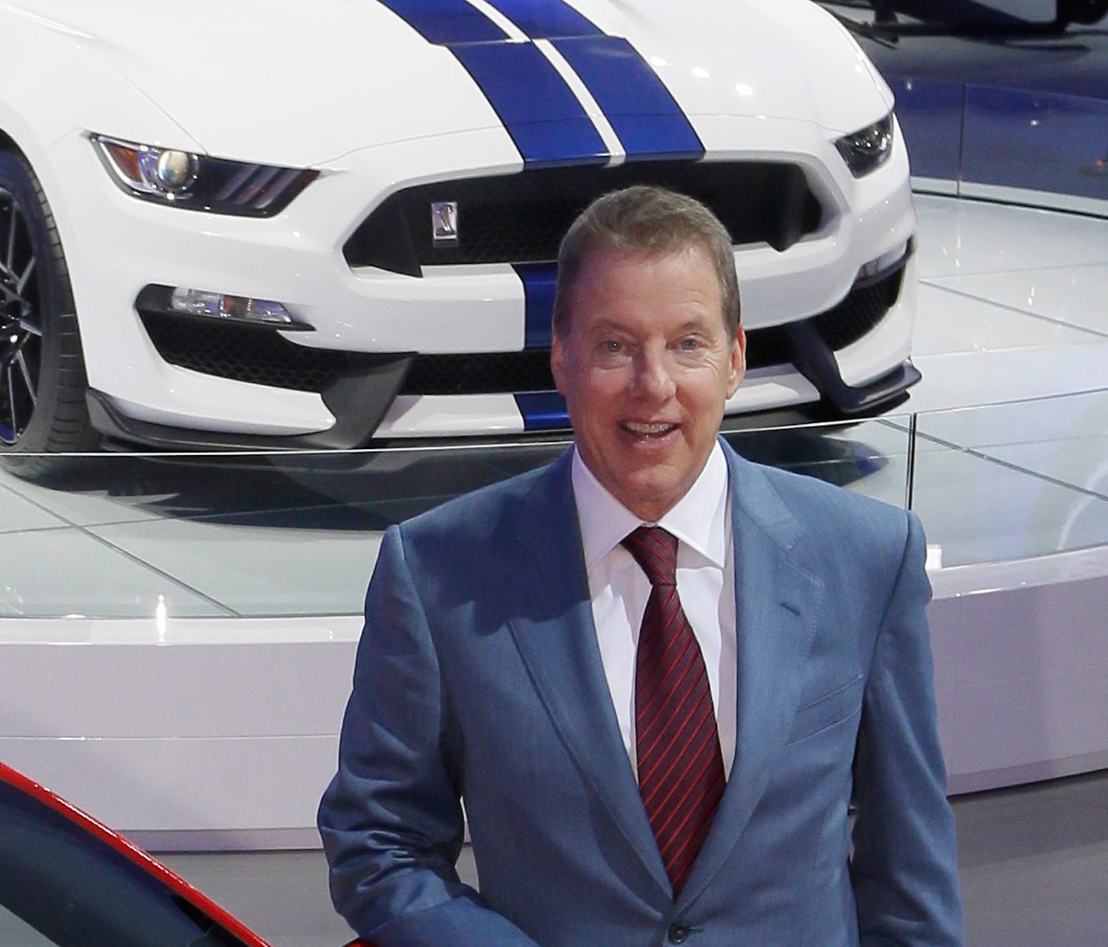 Executive Chairman Bill Ford stands by a Mustang