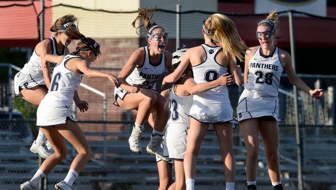 Pittsford players celebrate after their game-winning goal was confirmed during the 2017 NYSPHSAA Girls Lacrosse Championships Class A final at SUNY Cortland on June 10, 2017.