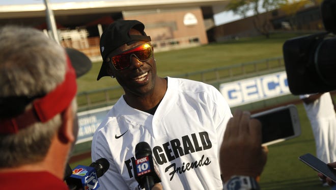 Terrell Owens answers questions before the Larry Fitzgerald Celebrity Softball game at Salt River Fields in Scottsdale, Ariz. on April 21, 2018.