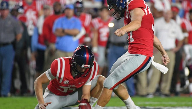 Ole Miss is tasked this season with replacing Gary Wunderlich, right, the most accurate placekicker in program history. (AP Photo/Thomas Graning)