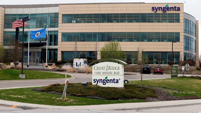 This April 18, 2017, file photo shows the suburban Minneapolis headquarters of Syngenta in Minnetonka, Minn. A Kansas federal jury awarded nearly $218 million Friday, June 23 to farmers who sued Swiss agribusiness giant Syngenta over its introduction of a genetically engineered corn seed variety.