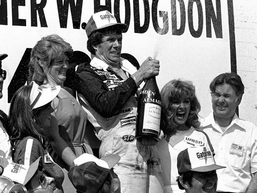 Darrell Waltrip, celebrating a victory in 1980, won
