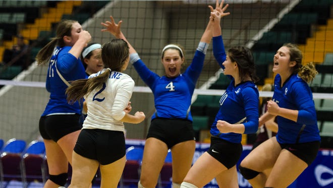 Haldane players come togther to celebtate after a scoring play during the Class D State Volleyball Finals Sunday November 22, 2015 at Glens Falls Civic Center.