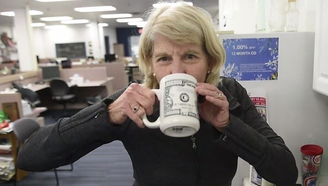 Mary Hance takes a sip of her Ms. Cheap Latte.