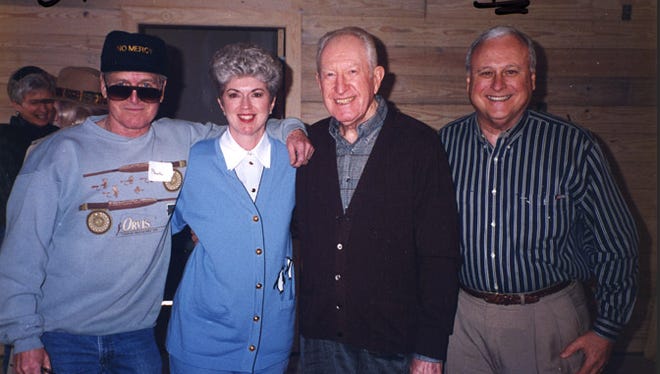 Jim and Jan Moran with Paul Newman and Whit Palmer touring the camper cabins in the Jim and Jan Moran Village at Camp Boggy Creek in January 1996.