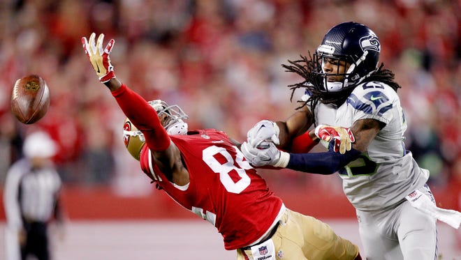 Seahawks like Richard Sherman, right, have been known to commit a foul or two in pass defense.