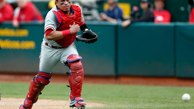 Philadelphia Phillies catcher Carlos Ruiz (51) chases a loose ball during the sixth inning Sept. 21 against the Oakland Athletics at O.co Coliseum. Credit: Bob Stanton-USA TODAY Sports