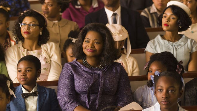 Octavia Spencer, in purple, plays Dorothy Vaughan, a mechanically inclined woman who fights for a supervisor title at NASA in the 1960s. Janelle Monáe, right in white hat, plays Mary Jackson in "Hidden Figures."