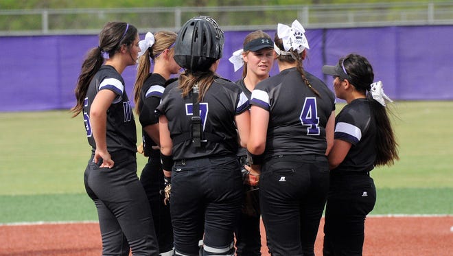 The Wylie softball team meets in the pitcher's circle during the Lady Bulldogs' 6-5 win against Sweetwater in the District 5-4A finale on Tuesday, April 17, 2018.