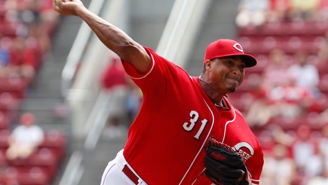Former Reds starting pitcher Alfredo Simon pitches during the first inning Sunday at GABP.