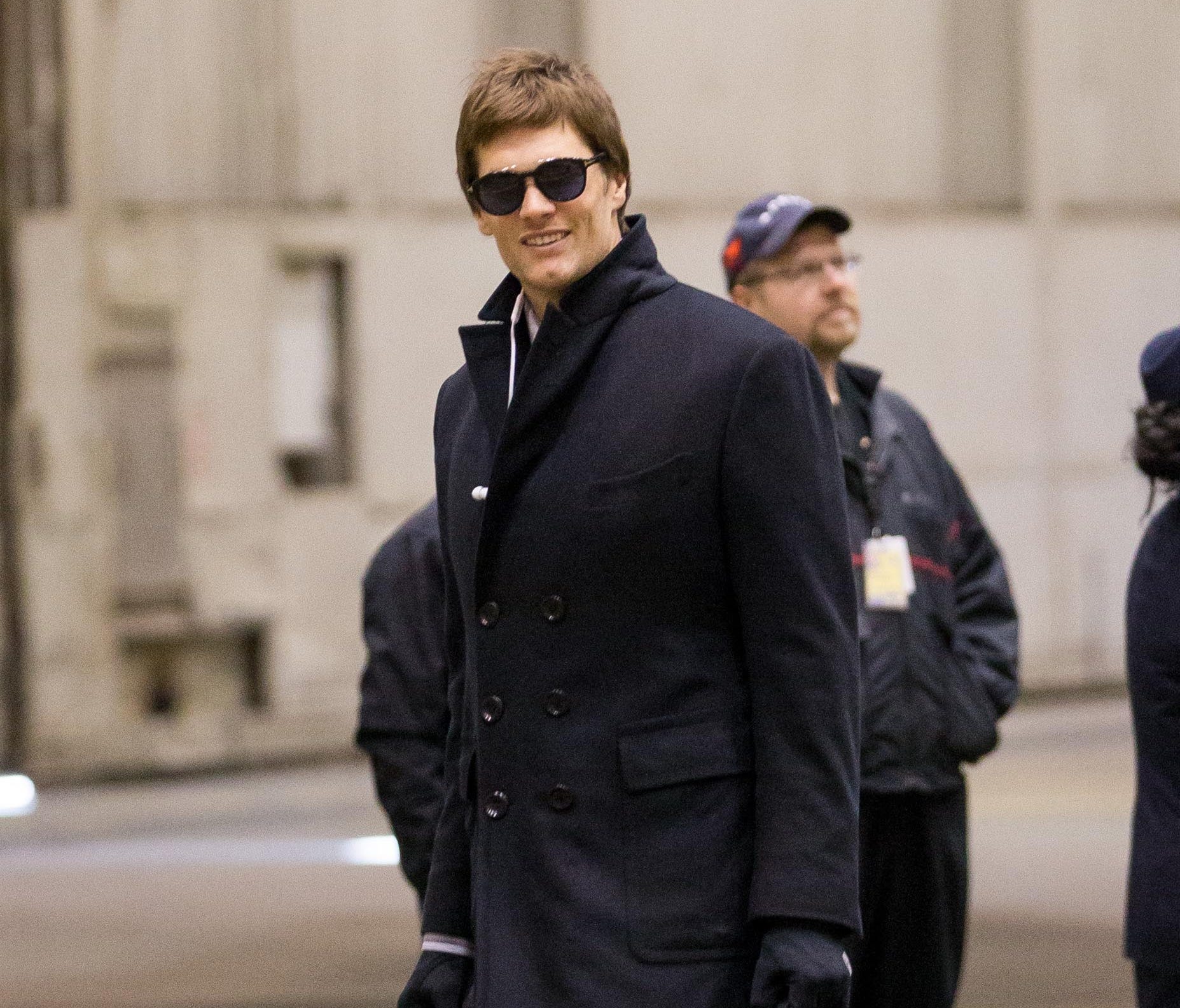 New England Patriots quarterback Tom Brady (12) exits the plane during team arrivals in advance of Super Bowl LII.