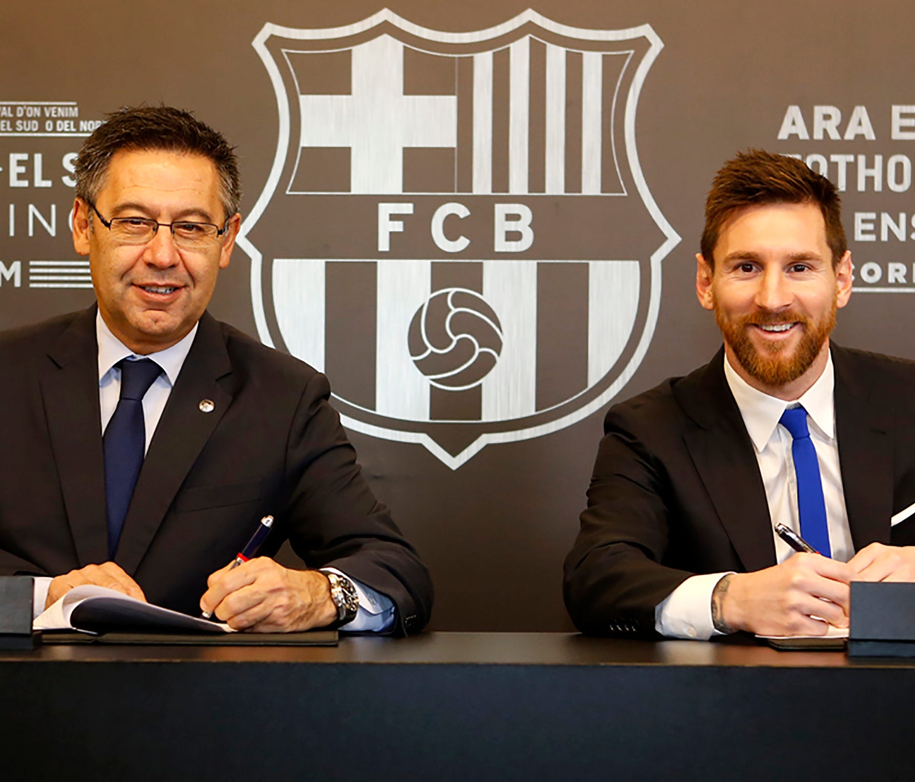 Lionel Messi signed a contract that will keep him with Barcelona through 2021.