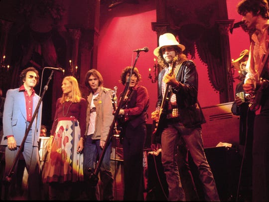 Classic rockers Neil Diamond, Joni Mitchell, Neil Young, Rick Danko, Bob Dylan and Robbie Robertson jam during The Band's final concert in 1978, captured in the motion picture, 'The Last Waltz.'