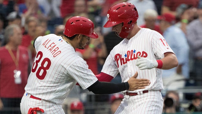 Philadelphia Phillies left fielder Rhys Hoskins (17) celebrates with catcher Jorge Alfaro (38) after hitting a three run home run during the second inning against the New York Yankees at Citizens Bank Park.