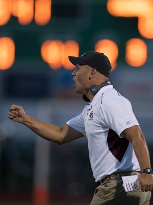 Henderson County Head Coach Josh Boston fires up his team against North from the sidelines at Bundrant Stadium Friday evening.