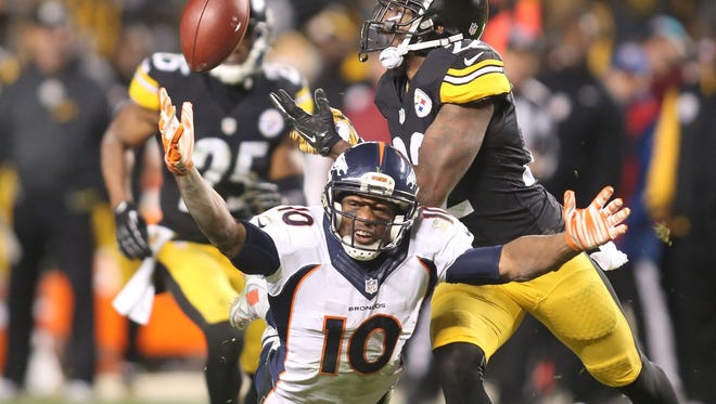 Pittsburgh Steelers cornerback William Gay (22) defends a pass intended for Denver Broncos wide receiver Emmanuel Sanders (10) on Denver's final offensive play during the fourth quarter at Heinz Field. The Steelers won 34-27.