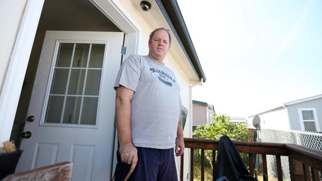 Howard Dowell, a disabled veteran who trained for Desert Storm, is seen Friday, July 31, at his Salem home.