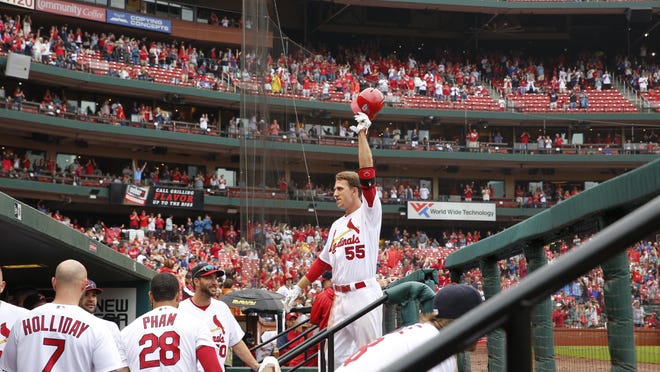 St. Louis' Stephen Piscotty waves to the crowd after hitting a grand slam during the sixth inning Sunday in St. Louis.