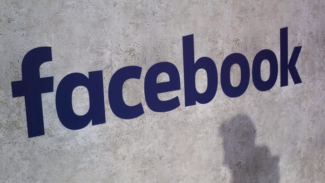File - This Jan. 17, 2017, file photo shows a Facebook logo being displayed in a start-up companies gathering at Paris' Station F, in Paris. A former employee of a Trump-affiliated data-mining firm says it used algorithms that "took fake news to the next level" using data inappropriately obtained from Facebook. (AP Photo/Thibault Camus, File)