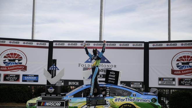 Kevin Harvick celebrates after winning the NASCAR Monster Energy Cup Series race at Atlanta Motor Speedway on Sunday, June 7, 2020, in Hampton, Ga.