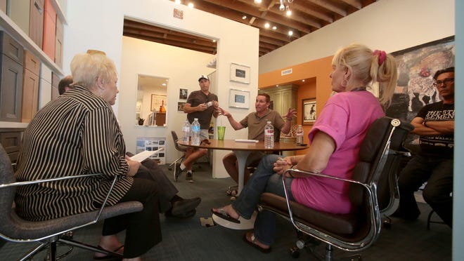 Benjamin Sullivan, center, the owner of KBC of Palm Springs, leads others tenants at the commercial complex his showroom and studio is located to ask Palm Springs City Council Woman Ginny Foat, left, for advice to keep from being evicted by the owner of the Indian land the complex is on. Photo taken at KBC in Palm Springs on Tuesday.