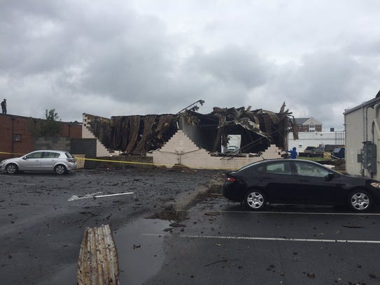 Damage to a building near the corner of Route 13 and