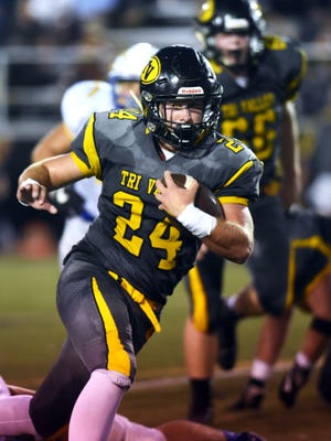 Tri-Valley's Chase Kendrick runs with the ball against Philo.
