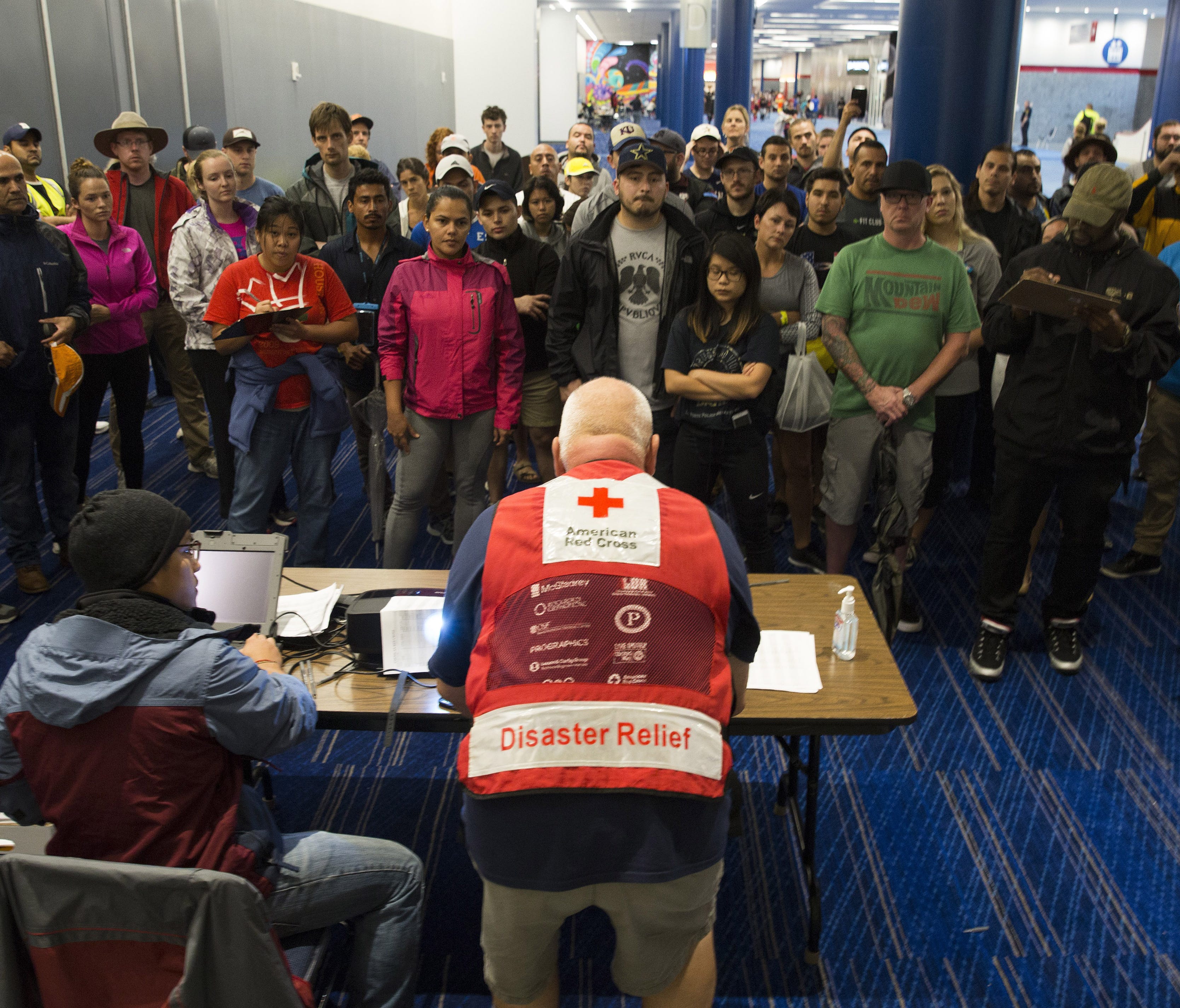 Hurricane volunteers are briefed at the George Brown Convention Center in Houston, which turned into an American Red Cross shelter after Hurricane Harvey tore through the Texas Gulf Coast in late August.