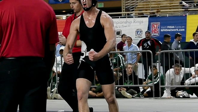 Matt Cates of Palm Bay defeats Natorian Lee of Orange Park for the state wrestling title at 170 pounds at the Class 2A state finals in Kissimmee.