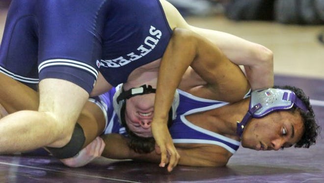 Anthony Guccione of Suffern pinned Nkosi Trought-Multali of New Rochelle in a 145 pound bout during a wrestling meet at New Rochelle High School Jan. 7, 2016.
