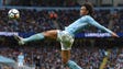 Manchester City midfielder Leroy Sane stretches for