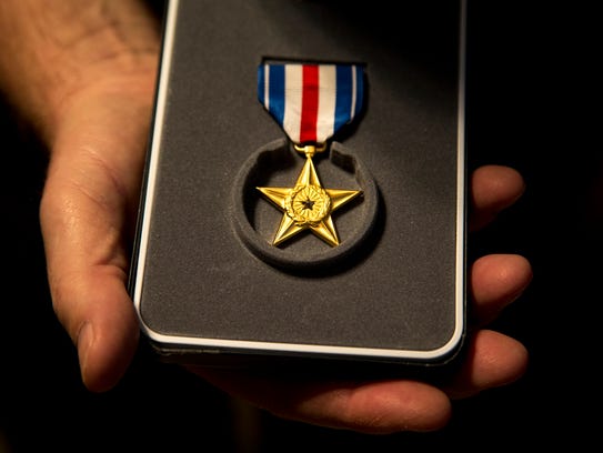 Bruce Shearer holds his Silver Star, May 5, 2017, in